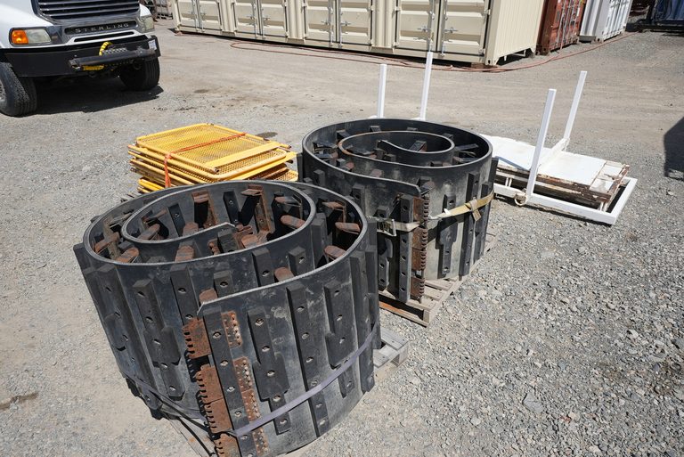 Crawler track sets included with the LF90D package, on pallets.